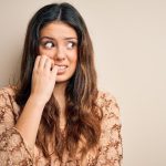 Why do you indulge in nail biting and how to stop it | HealthShots